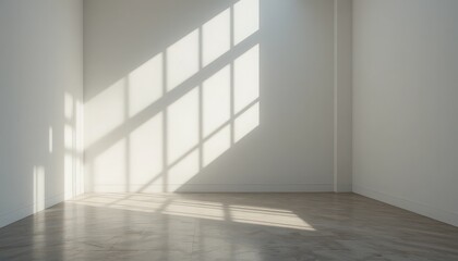 Bright sunlight streaming through windows creates patterned shadows on a minimalist room's floor in the morning