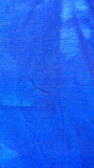 Texture of blue fabric close-up. Fabric background
Blue synthetic material background
