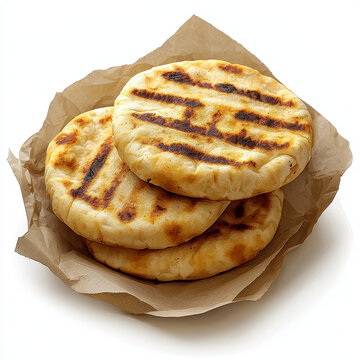 Delicious arepas stacked in basket, showcasing their grilled texture and golden color