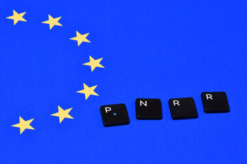 words 'PNRR' on Flag of EU. The National Recovery and Resilience Plan is part of the Next Generation EU Programme.