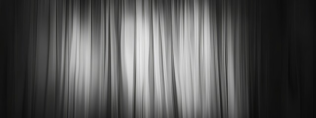 Abstract grayscale image of vertical lines resembling curtains, creating a dramatic and moody atmosphere.