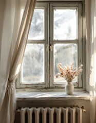 A rustic wooden window with sheer curtains and a vase of dried flowers bathed in soft sunlight