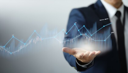 비즈니스 정장을 입은 남성의 손위에 떠있는 주식차트