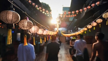 Obraz premium Beneath the warm glow of traditional hanging lanterns, a vibrant street festival comes alive, with people enjoying the spirited and joyful atmosphere.