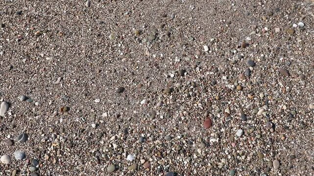 Sea waves in beach sand