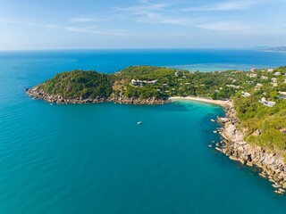 Fototapeta premium Coastal view from above showing turquoise waters and lush greenery on a tropical island