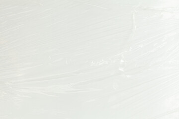 Abstract texture of clear plastic wrap, showing wrinkles and folds.  Great for backgrounds or...