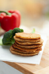 Stack of savory pancakes with fresh vegetables. Healthy and delicious breakfast or snack option.