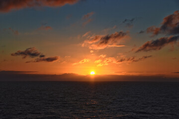 Obraz premium Nordic Ocean Sunrise of the coast of Norway from boat, Summer 2024, Scandinavia, Europe. 