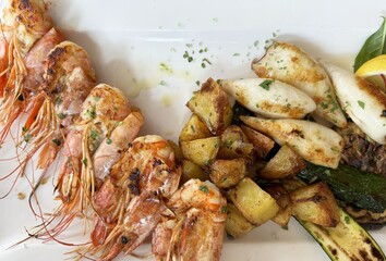 Grilled seafood platter with shrimp calamari and roasted vegetables