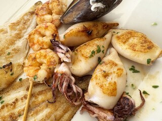 Grilled seafood platter: shrimp, calamari, mussel, sole fillet
