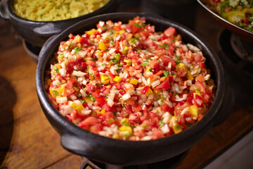 Campaign sauce in a clay pot. Accompaniment for barbecue meat, also known as vinaigrette and known...