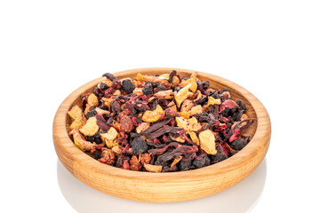 Carpathian forest fragrant tea with wooden utensils, macro, isolated on white background.