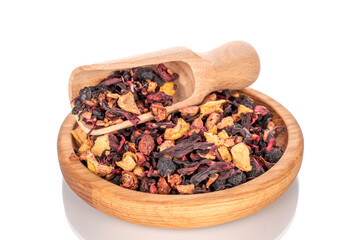 Carpathian forest fragrant tea with wooden utensils, macro, isolated on white background.