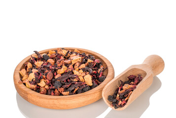 Carpathian forest fragrant tea with wooden utensils, macro, isolated on white background.