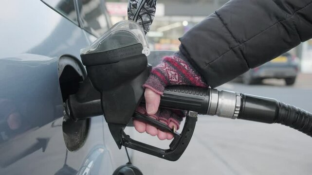 Close up of person filling car with diesel