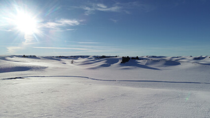 Drone photo of the Camas Prairie in Idaho featuring the plowed farm fields in winter with a blanket of snow.