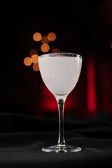 white cocktail in a sugar-coated glass