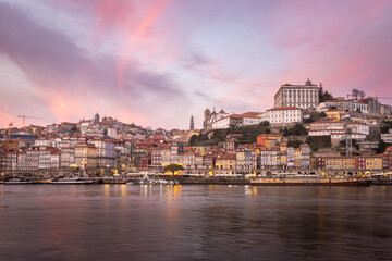 Porto (Portugal) and its beautiful and picturesque historical architecture of ancient Europe. Colorful buildings of the Portuguese city at sunset