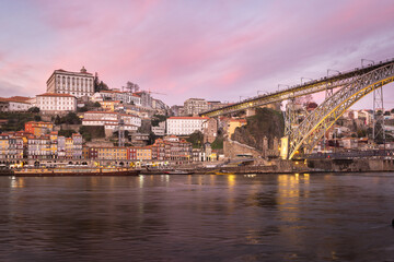 Fototapeta premium Porto (Portugal) and its beautiful and picturesque historical architecture of ancient Europe. Colorful buildings of the Portuguese city at sunset