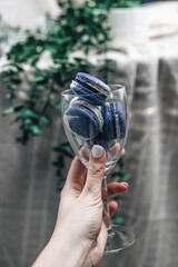 A glass of colorful and unique macarons