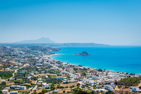 Sunny panoramic view of Kampos village, Agios Stefanos and Kefalos beach with Island Kastri in the middle on Kos Island, Greece