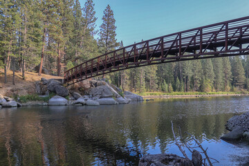 Photo of walk bridge at Winchester State Park on the Camas Prairie in Idaho reflecting in Winchester Lake