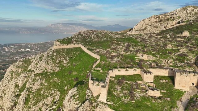 View Of Acrocorinth Castle In Monolithic Rock Overlooking The Ancient City of Corinth, Greece. Aerial Shot