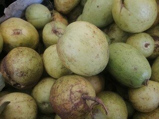 Guava fruit on a market background