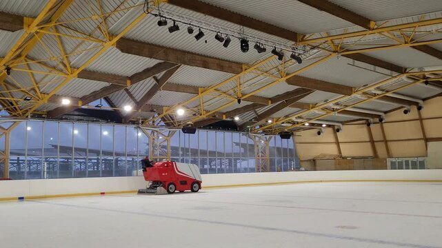 An ice resurfacer smooths the ice of an ice rink