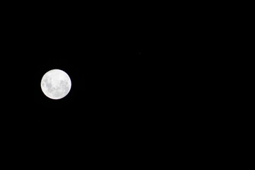 full moon in the night sky. full moon over sky. Moon in the sky.