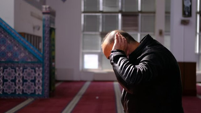 Man Raising His Hands in Prayer