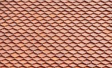 Seamless pattern of red tiles on rooftop.