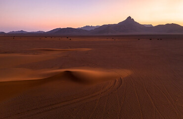 Africa - Sundowner in the Desert with Dunes in front of Mountain Range, Namibia