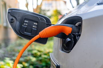 A car is being charged with electricity