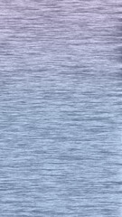 background pattern of wavy water surface reflecting shads of color 