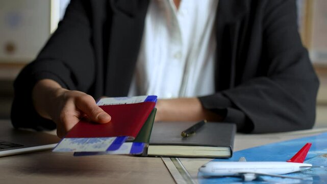 Agent giving passports and tickets to man close up. Person buying flight tickets in travel agency for summer vacation