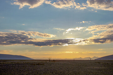 Sunrise over desert landscape Sossusvlei in the Namib Desert, Namibia 