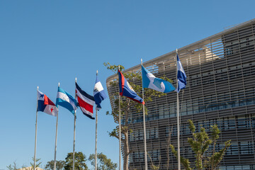 Waving flags of the seven Central American countries - Belize, Costa Rica, El Salvador, Guatemala,...