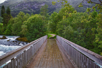 Fototapeta premium Olden Norway 2024 hiking views towards Briksdal Glacier, Jostedal Glacier largest glacier on Europe's mainland. Glacial river flowing to Sognefjord. Scandinavia, Nordic.