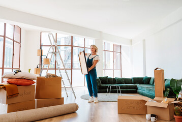 Single woman relocating in a new apartment