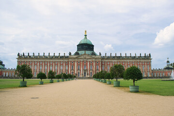 Obraz premium Grand Palace Sanssouci with Dome and Manicured Gardens