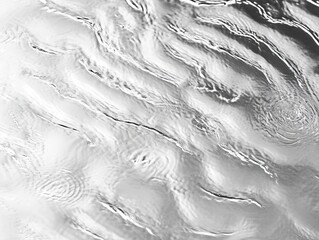 Obraz premium Abstract grayscale image of flowing water with ripple patterns.