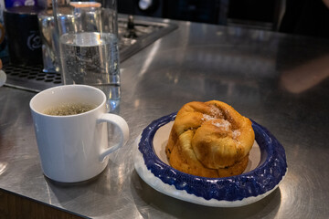 delicious pastries, bun with cardamom on a plate
