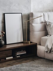 Modern minimalist interior, cozy living room, neutral tones, beige sofa, wooden side table, blank picture frame, textured wall, soft lighting, decorative vase, stacked books, hygge atmosphere, Scandin
