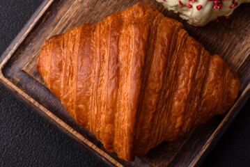 Sweet fresh crispy croissant with chocolate filling