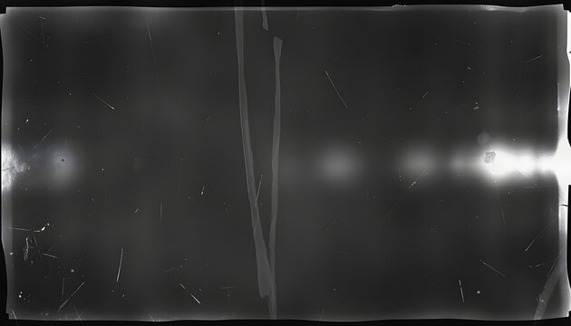 Black and white film negative texture background with dust, scratches and grunge frame for a vintage video tape effect. dreamy vintage destroyed photo or film light leaks texture overlay with vignet
