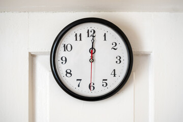 Full clock face showing minutes past noon just past 12 AM or twelve PM time concept, front view,...
