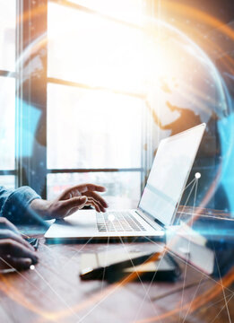 Male hands with laptop. Man working remotely at home. Concept of networking or remote work. Global business network.