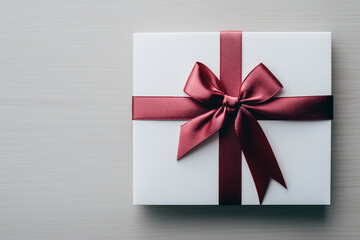 A white box with a red ribbon tied around it. Generative Ai.
